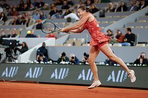 Aryna Sabalenka plays a shot against Erika Andreeva